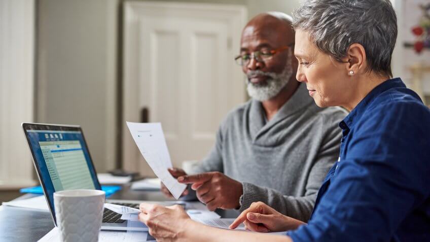 Cropped shot of a senior couple working on their finances at home.