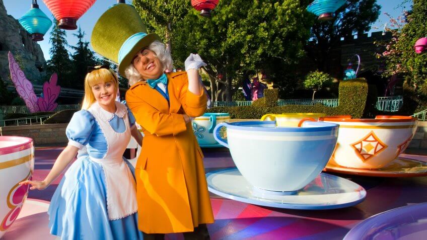 A VERY MERRY UN-BIRTHDAY -- Alice and the Mad Hatter from the classic Walt Disney animated feature "Alice in Wonderland", pose at the Mad Tea Party at Disneyland in Anaheim, Calif.