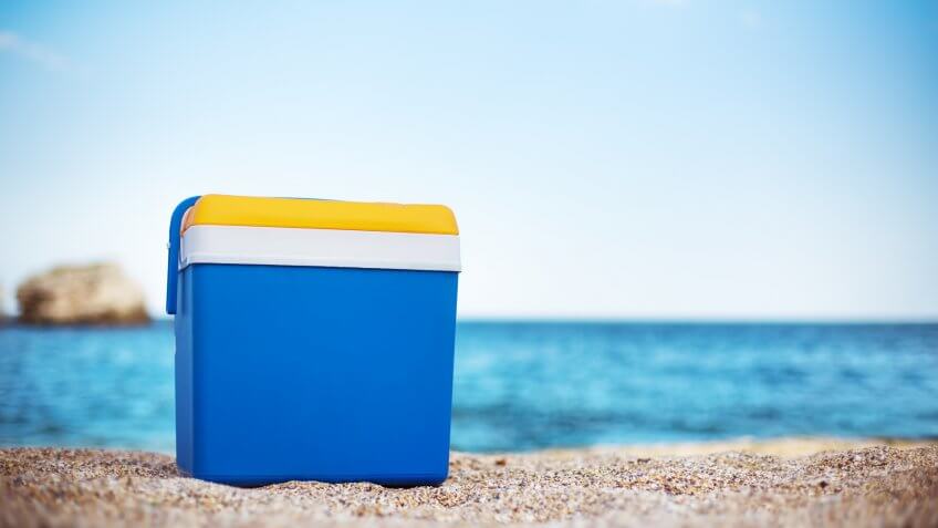 Blue cooler box on the beach.