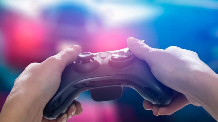 gaming game play tv fun gamer gamepad guy controller video console playing player holding hobby playful enjoyment view concept - stock image.