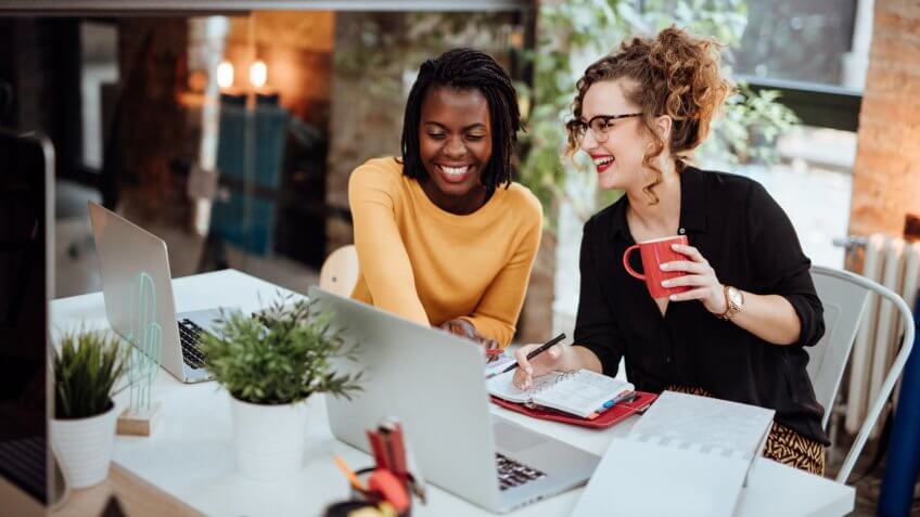 Businesswomen Working On Computer