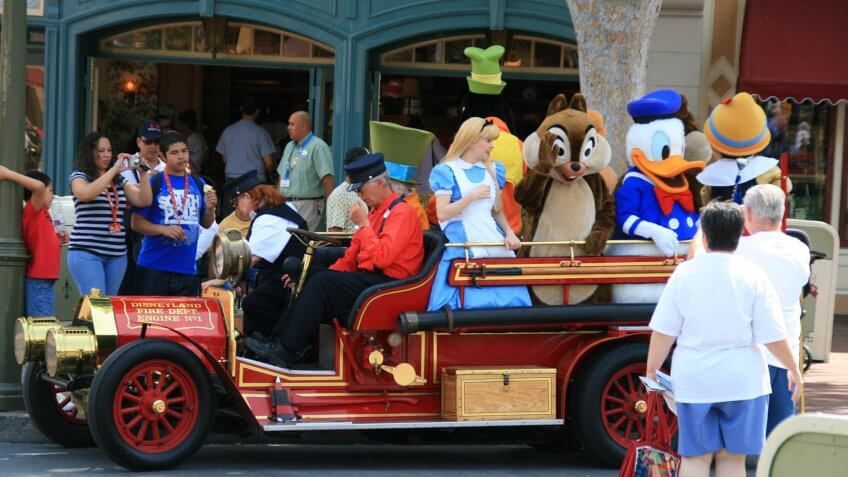 Disney characters on a fire engine replica.