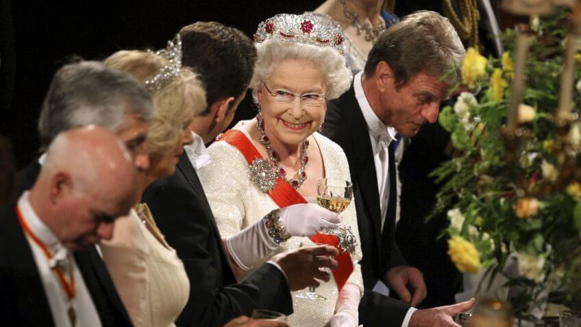 Queen Elizabeth II toasts with France's President Nicolas Sarkozy and wife Carla Bruni Sarkozy