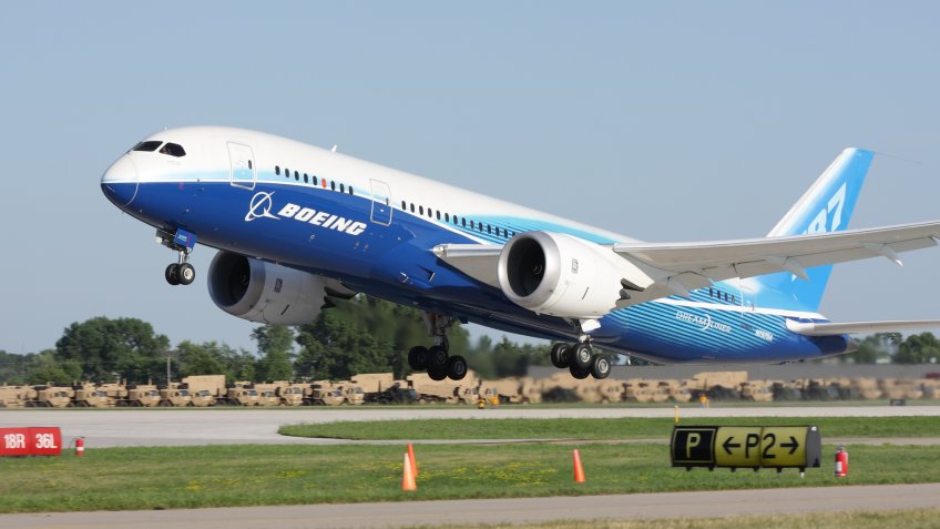 "Oshkosh, WI, USA - July 29, 2011: Brand new Boeing 787 Dreamliner in factory paint scheme taking off during EAA Airventure 2011.