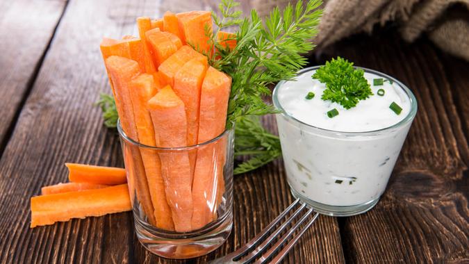 Fresh made Carrot Sticks in a glass (diet food).