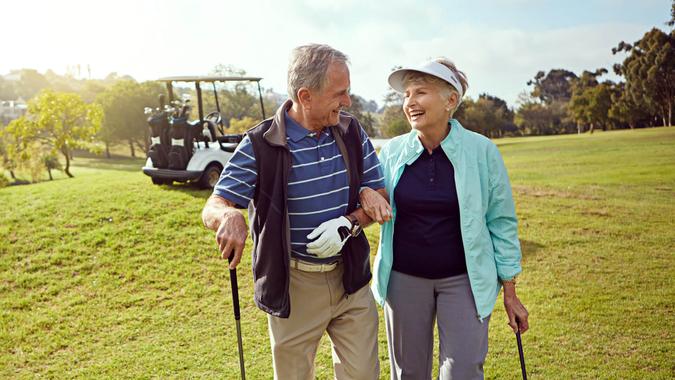 Shot of a smiling senior couple enjoying a day on the golf course.