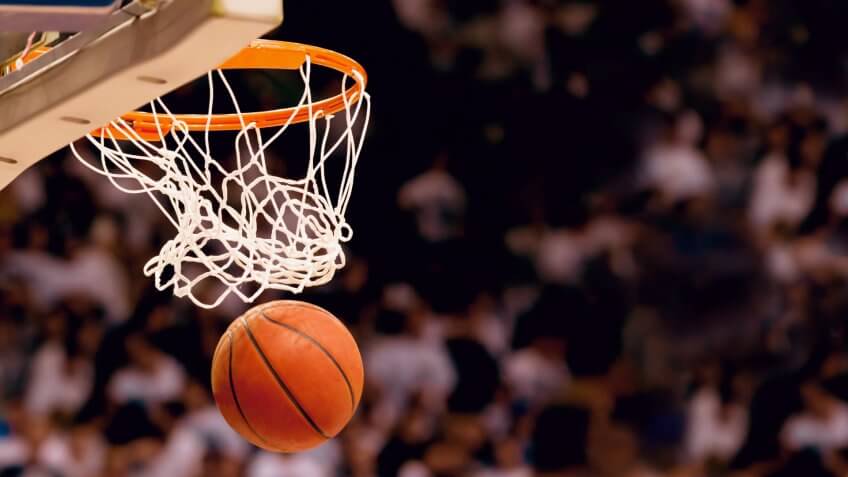 Scoring the winning points at a basketball game.