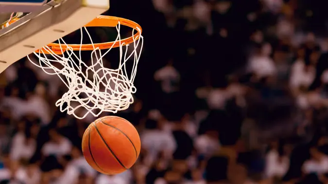 Scoring the winning points at a basketball game.