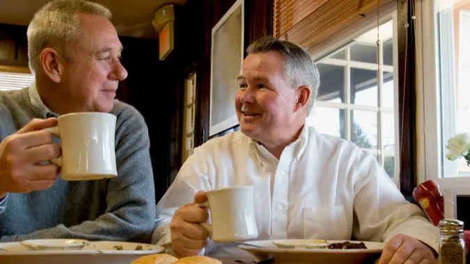 Two senior men in a restaurant.