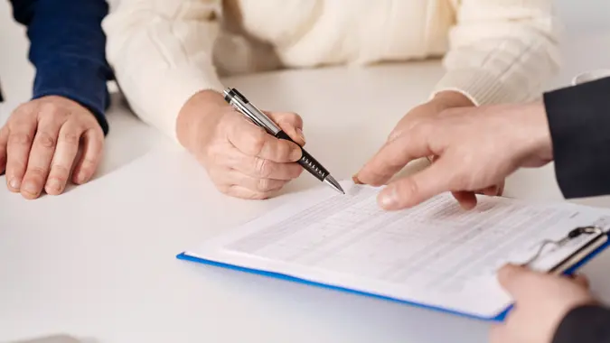 Signing mortgage loan.