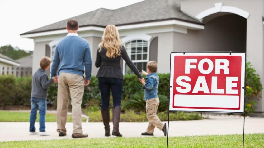 house with FOR SALE sign