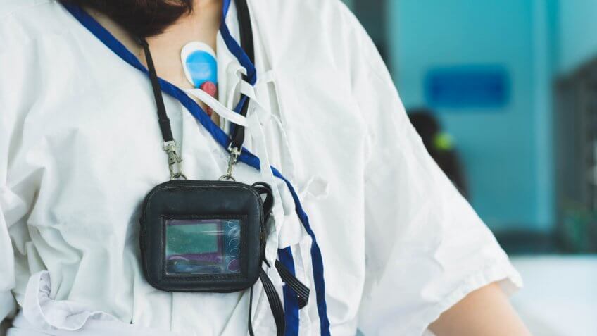 patient wearing holter monitor device for monitoring of an electrocardiogram 24 hour Heart investigation activity.