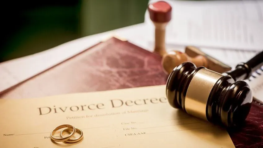 Divorce decree and wooden gavel.