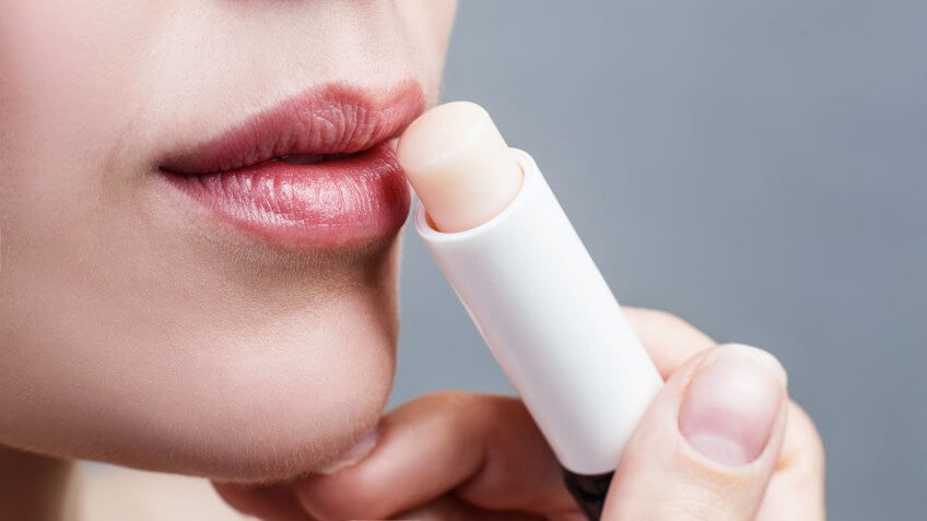 applying lip balm