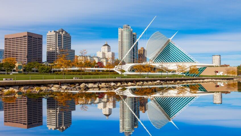 Skyscrapers skyline of Milwaukee and reflections in Lake Michigan, WI.