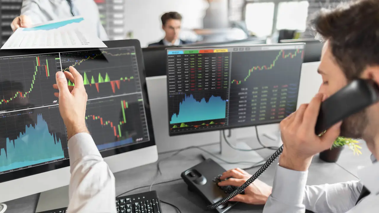 Business team investment trading do this deal on a stock exchange.