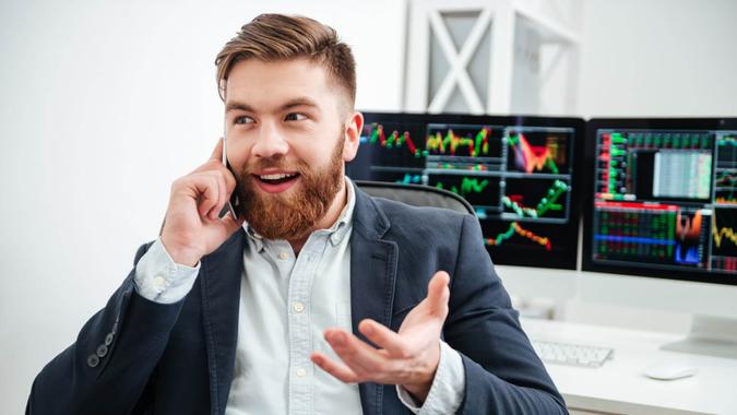 investor looks happy reviewing portfolio