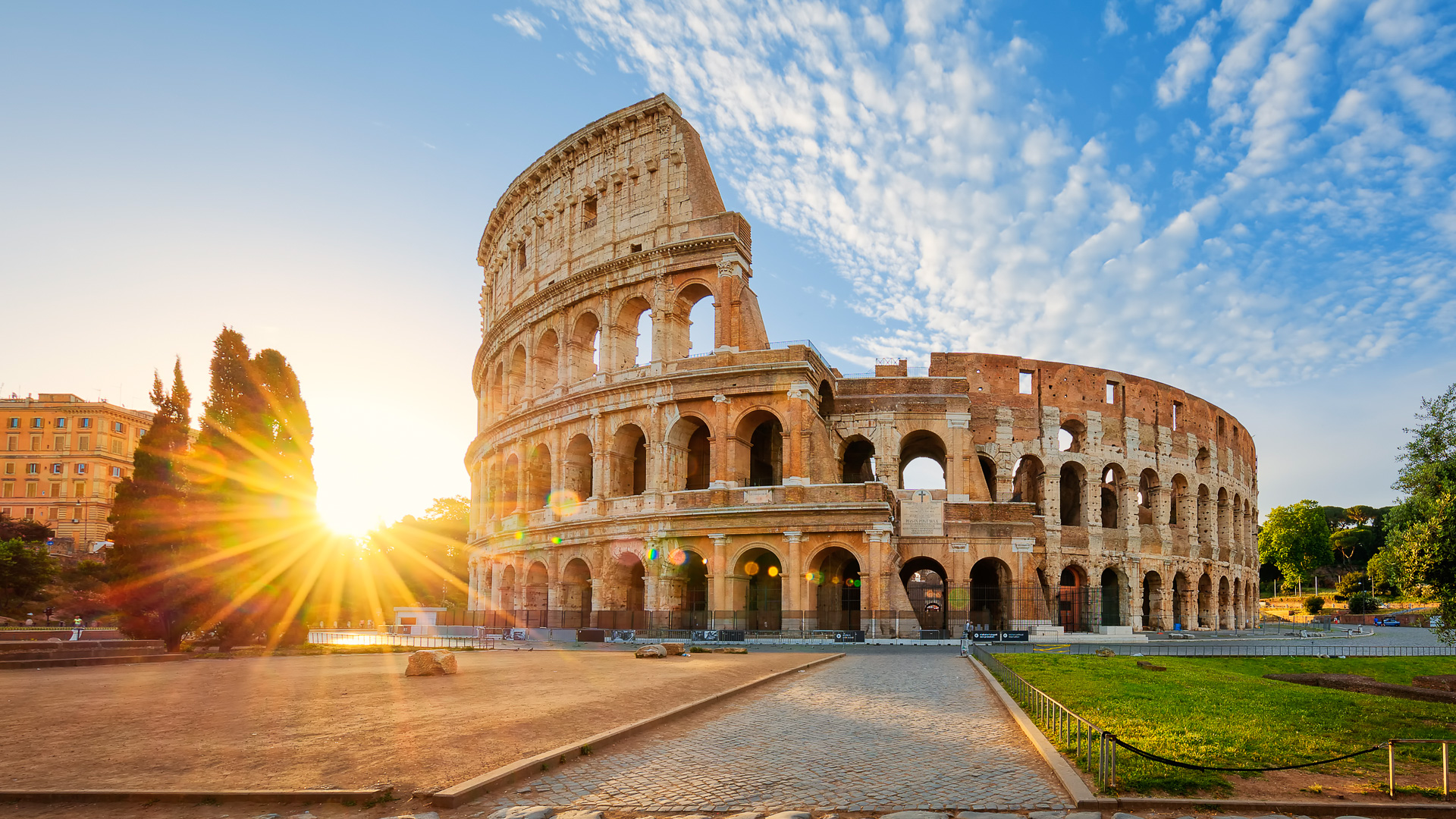 View of Colosseum in Rome and morning sun, Italy, Europe.