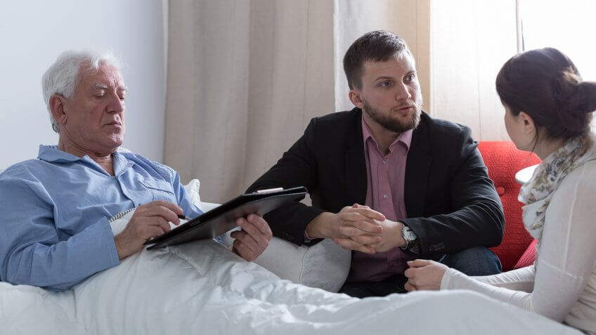 Image of terminally ill father making a will.
