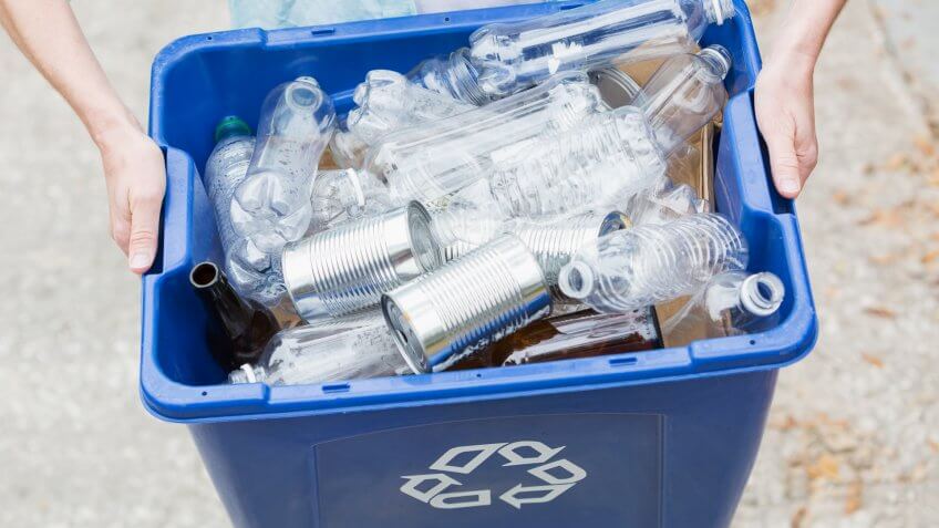 taking recycling bin out to the curb for collection