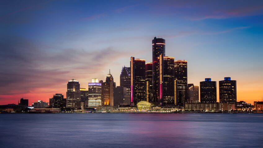 A cityscape of Detroit, Michigan at dusk.
