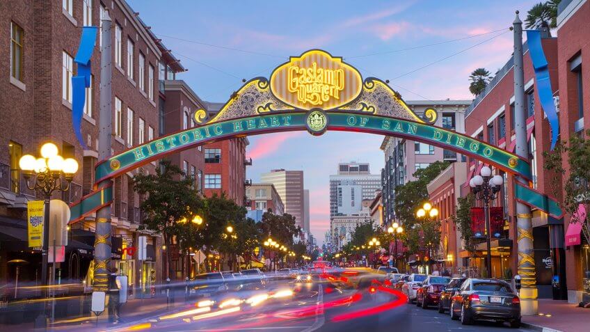 Downtown San Diego Gaslamp sign over moving traffic.