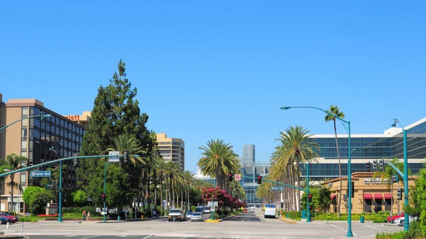 Anaheim, United States - September 8, 2011: A street scene of Anaheim's Convention Center area, which has hotels like a Hilton Hotel (on the right side) as well as the Anaheim Convention center down the end of Convention Way.