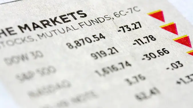 Close-up of stock market numbers going down, selective focus.