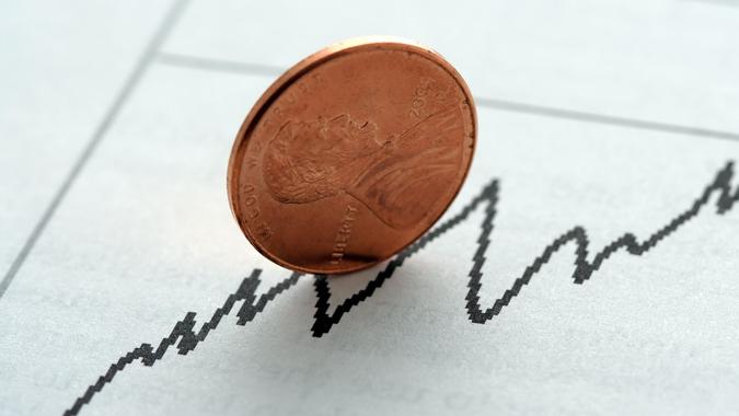 Stock graph with upward trend, symbolized with a penny.