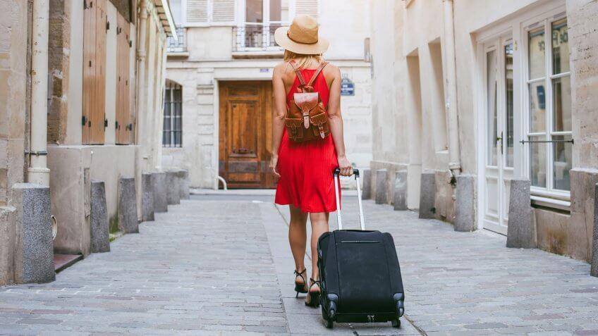 tourist walking with suitcase