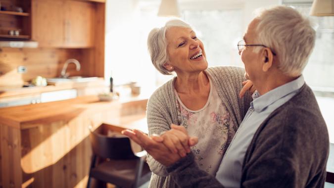 Close up of a senior couple dancing.