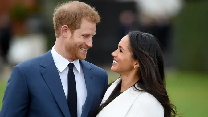 Mandatory Credit: Photo by FACUNDO ARRIZABALAGA/EPA-EFE/REX/Shutterstock (9243878t)Britain's Prince Harry pose with Meghan Markle during a photocall after announcing their engagement in the Sunken Garden in Kensington Palace in London, Britain, 27 November.