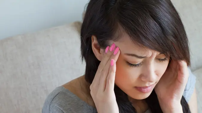 dizzy woman with headache