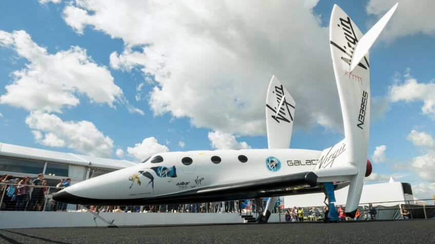 FARNBOROUGH, UK - JULY 15: The futuristic Virgin Galactic reuseable, sub-orbital spacecraft on static display at the Farnborough International Airshow, UK on July 15, 2012.