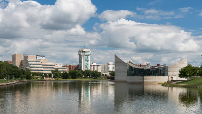 WICHITA, KANSAS - AUGUST 13: The Arkansas River and downtown Wichita from the Keeper of the Plains statue on August 13, 2017 in Wichita, Kansas.