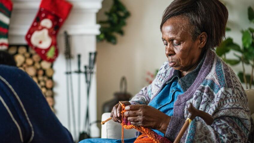 elderly woman knitting