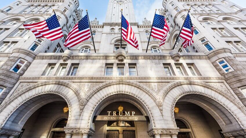 Washington DC, USA - January 28, 2017: Trump International Hotel and the Old Post Office Tower entrance with american flags.