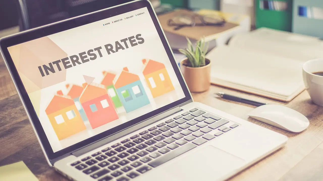 Reviewing interest rates on a laptop