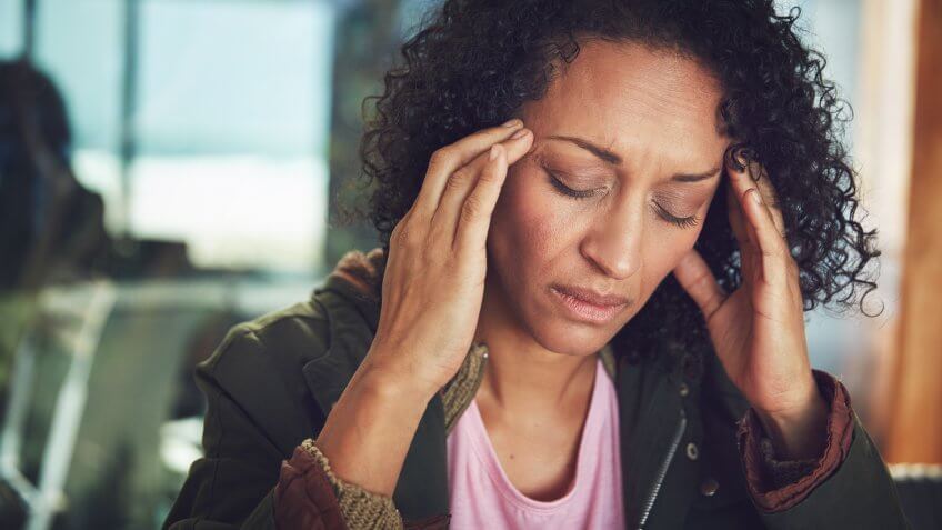 Shot of a mature woman experiencing a headache.