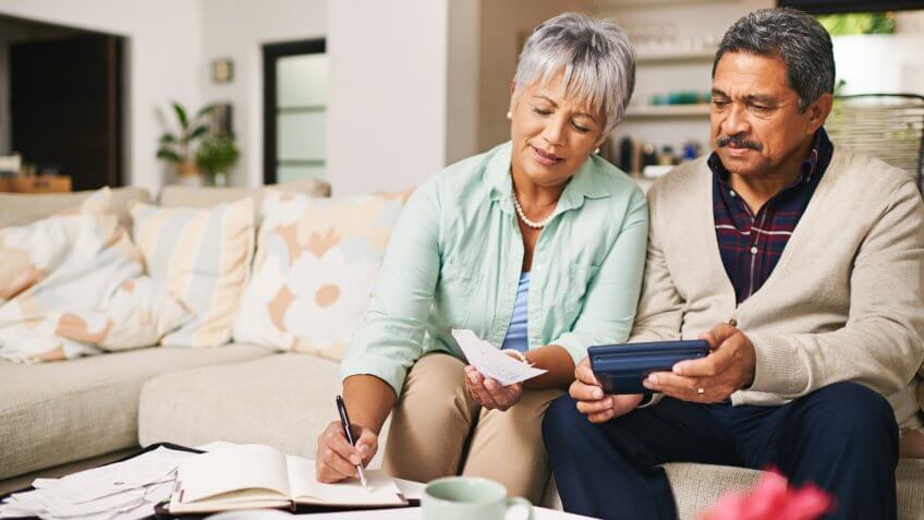 elderly couple working out a budget