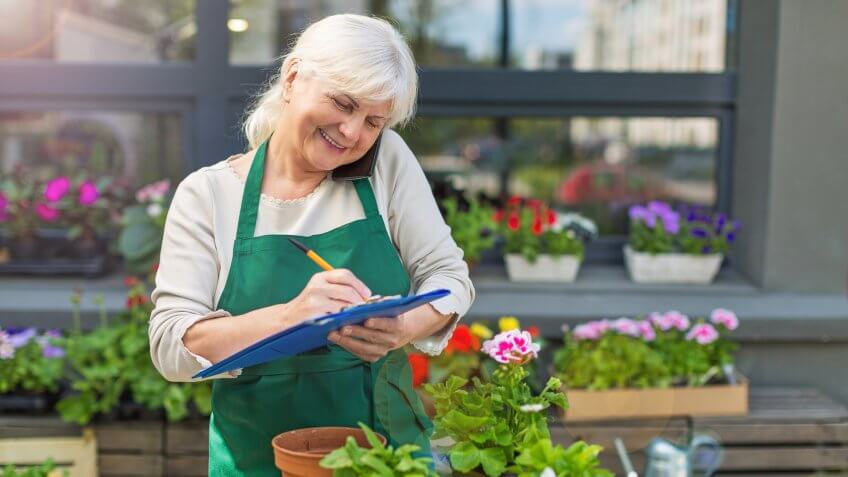 retired woman working in nursery