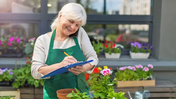 retired woman working in nursery