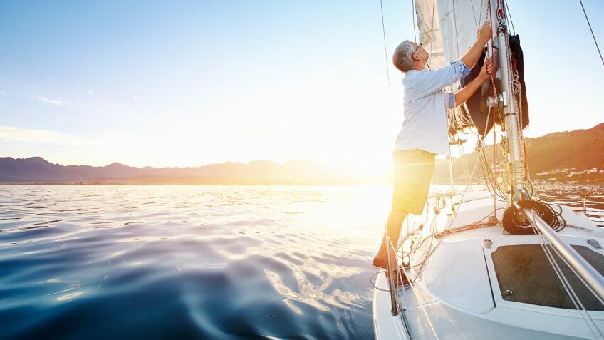 sunrise sailing, man on boat