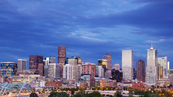 The skyscrapers in the skyline of Denver, Colorado at sunset.