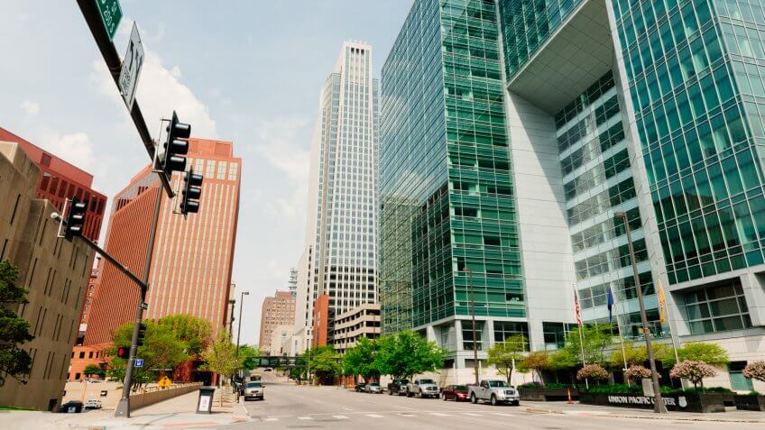 Omaha, United States - May 7, 2016: Large office buildings for several businesses line the landscaped downtown streets that have little traffic on a Saturday.