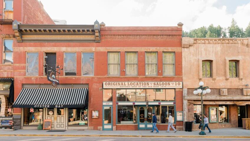 Deadwood, United States - May 8, 2016: Historic buildings in this Western South Dakota town remain active with a variety of retail businesses.