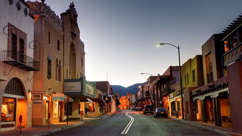 Santa Fe, New Mexico, USA - April 17, 2012: Road in the business district leading to the Cathedral Basilica of Saint Francis of Assisi at dawn.