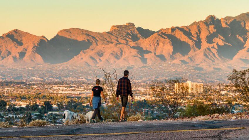 couple-walking-dog-in-Tucson