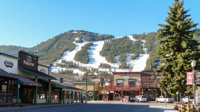 Jackson Hole, WY, USA - May 13, 2008: Ski slopes in Jackson Hole with panorama of vintage houses.