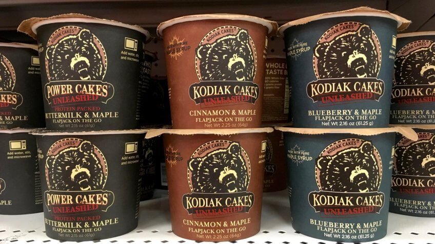 Alameda, CA - August 10, 2017: Grocery store shelf with cups of Kodiak Cakes brand Powder Cakes pancake mix.